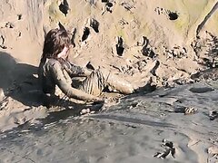 Filthy Mud Girl In Chest Waders Mucking Around