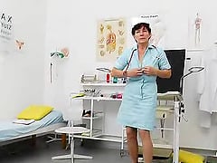 Granny Nurse Gets In The Exam Chair And Looks In Her Pussy